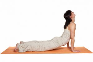 woman in yogapose dog up